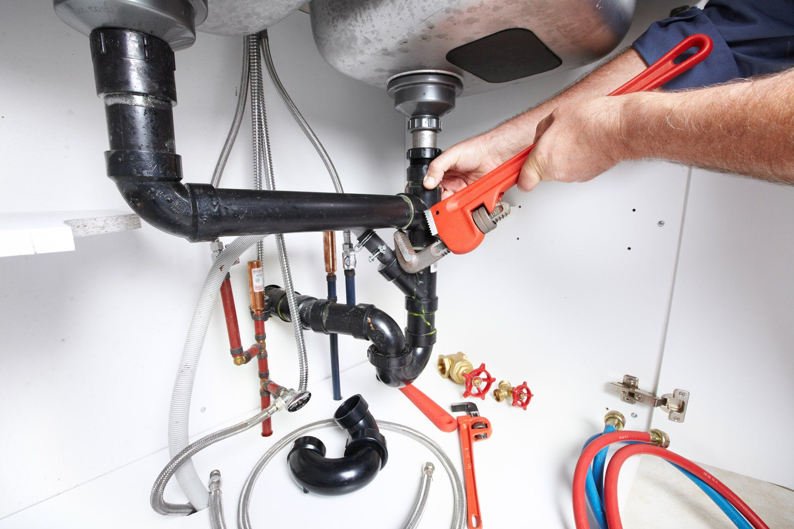 hands of professional plumber