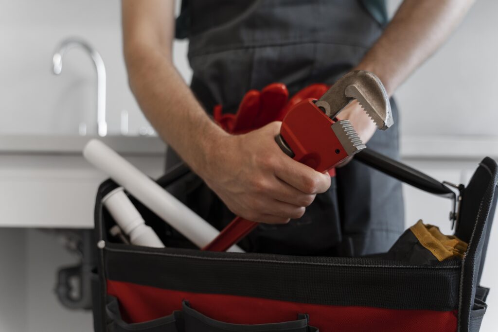 Man using plumbing tools