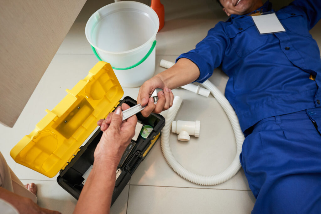 Man using plumbing tools